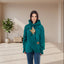 Person wearing a teal Forest Green hoodie with a cat design on a white background