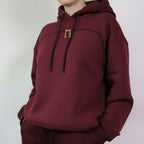  Burgundy hoodie & pants worn by a person against a plain background