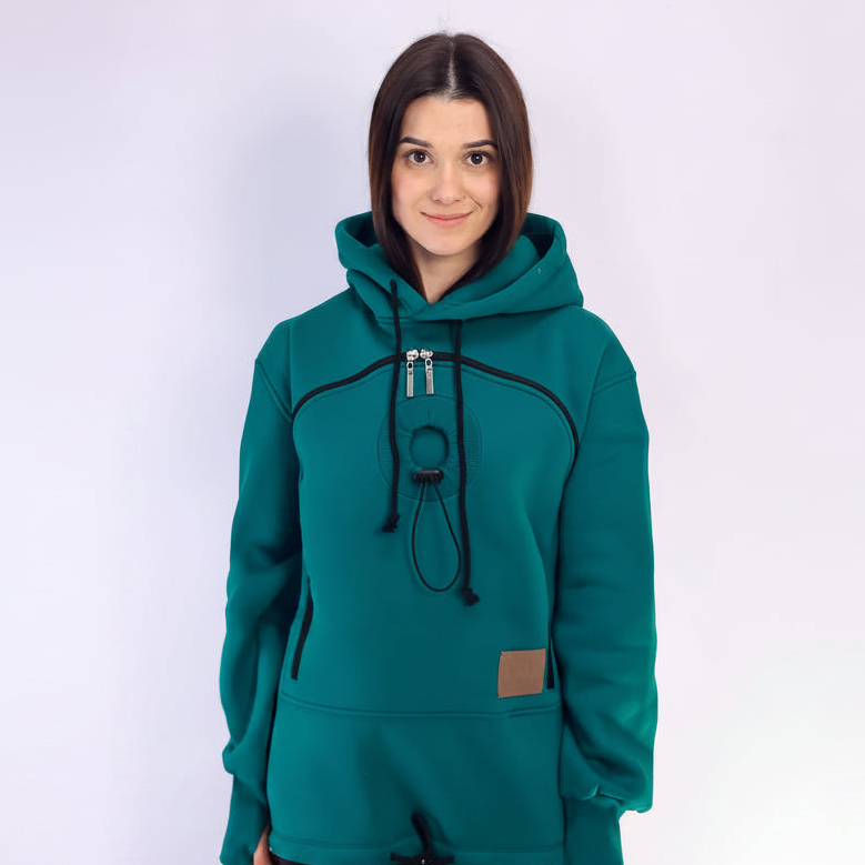 Person wearing a teal hoodie with a white background