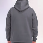 Gray hoodie worn by a person on a white background