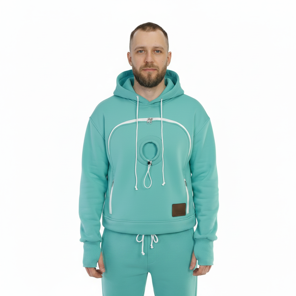 Man wearing a mint hoodie and pants set on a white background