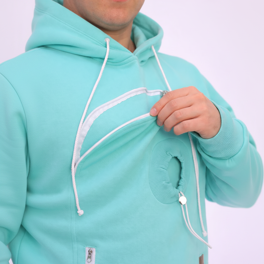 Person wearing a mint green hoodie with white drawstrings on a white background