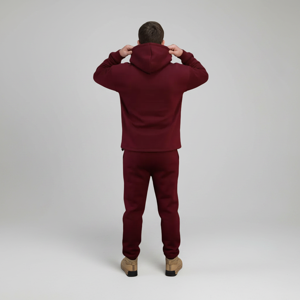 Person wearing a Red Burgundy tracksuit on a white background