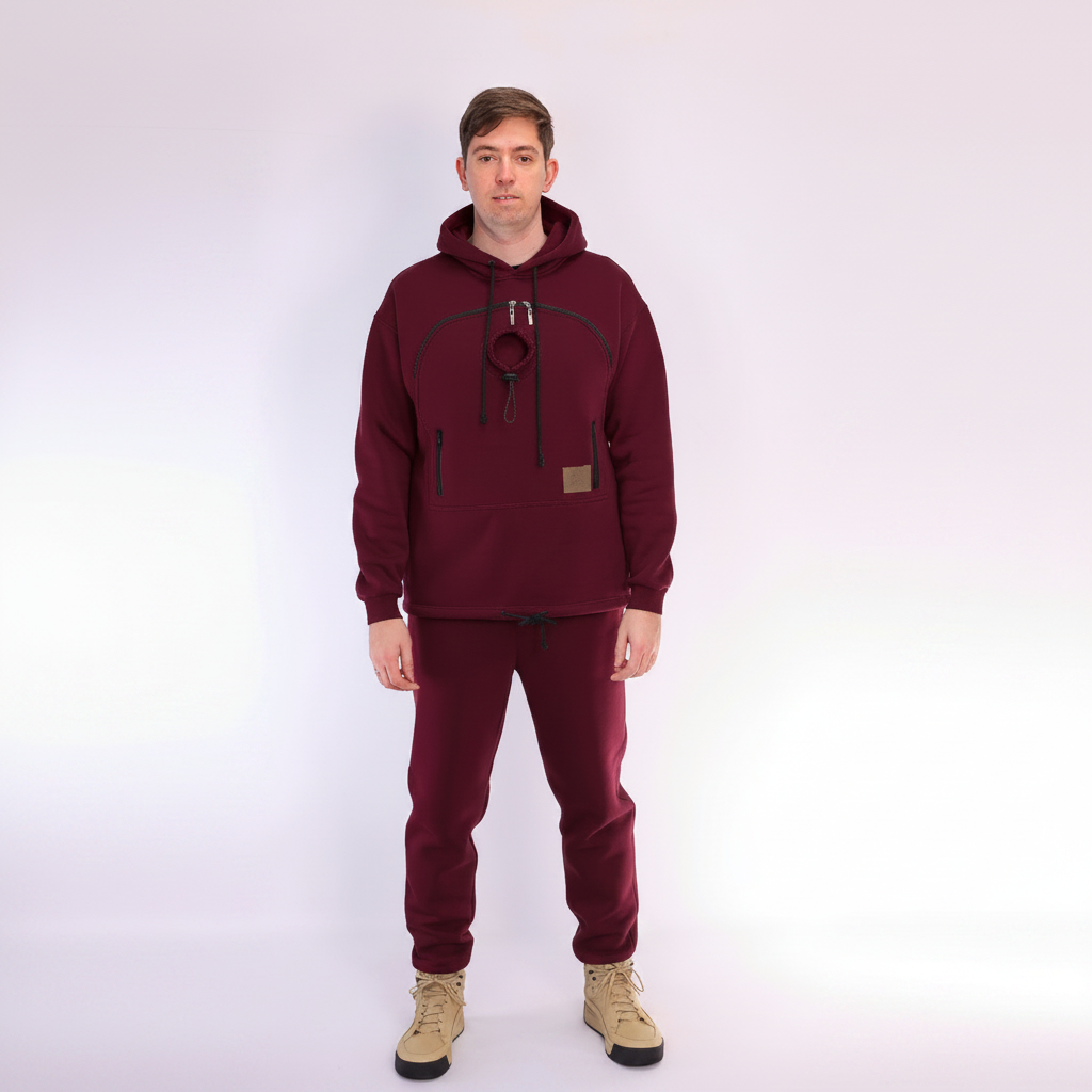 Person wearing a Red Burgundy hoodie and pants with beige boots on a white background