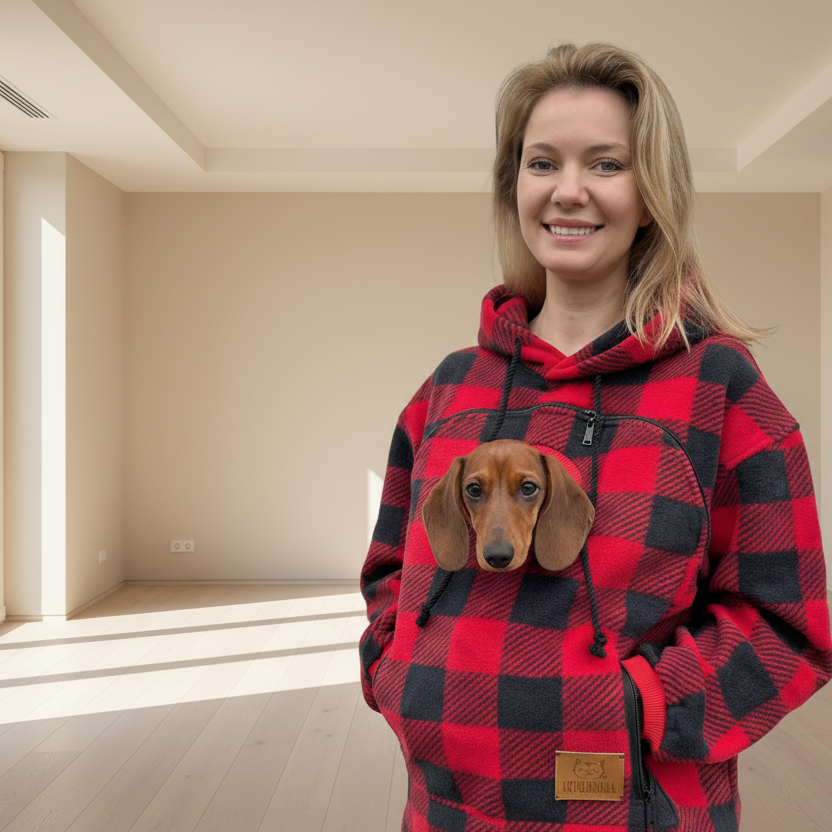 Woman wearing a red and black checkered hoodie with a dog peeking out from inside.