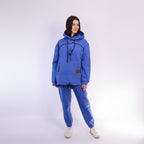 Person wearing a Royal Blue tracksuit on a white background