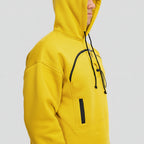 Yellow hoodie with black zippers on a white background