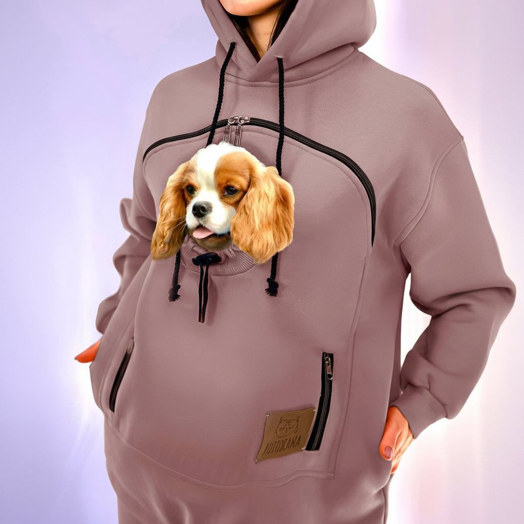 Person wearing a hoodie with a dog face design on a light purple background