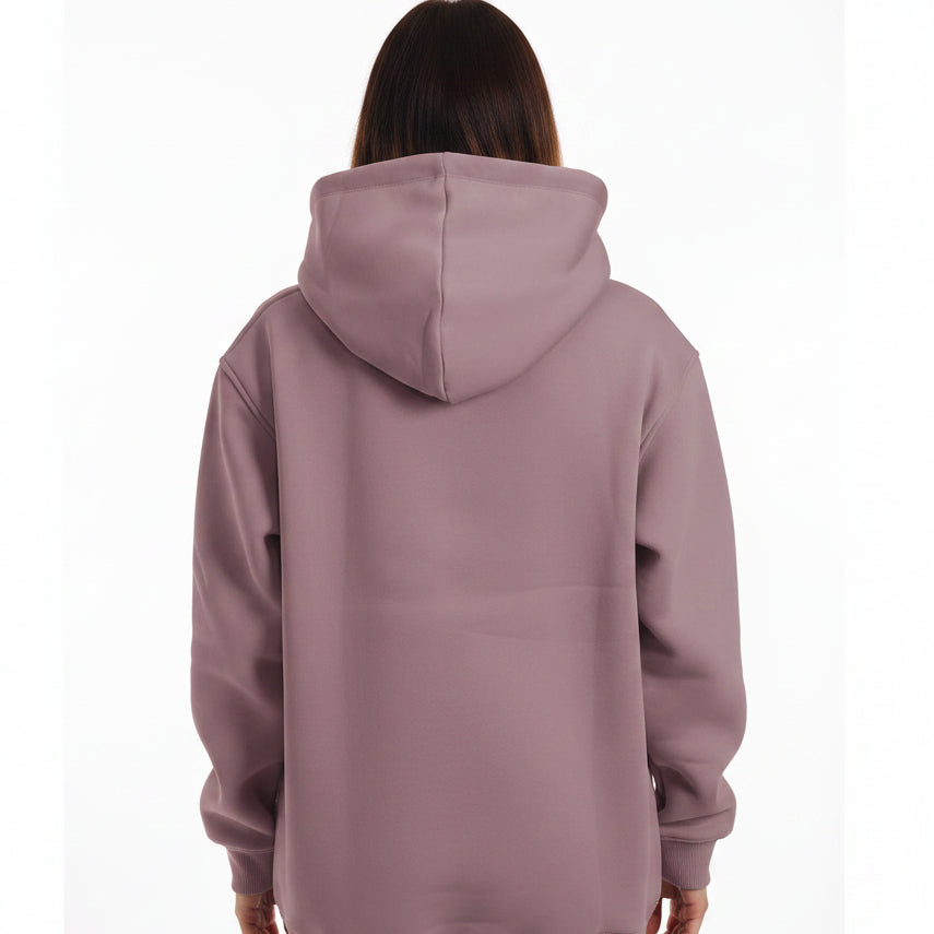 Beige hoodie worn by a person on a white background