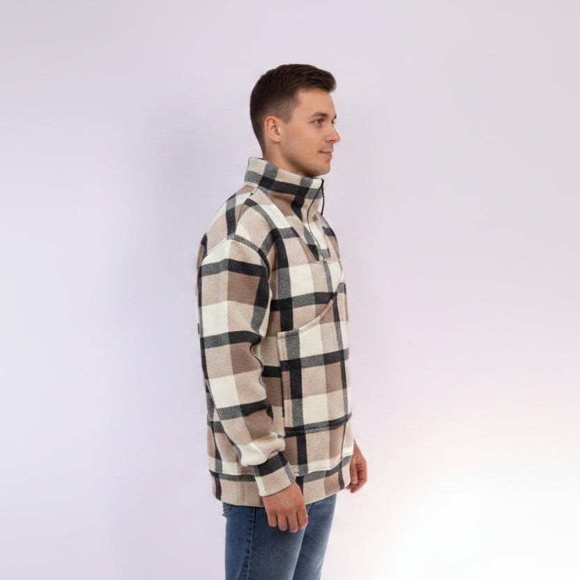Man wearing a plaid shirt on a light purple background