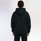 Black hoodie worn by a person on a white background