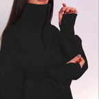 Black sweater worn by a person on a white background