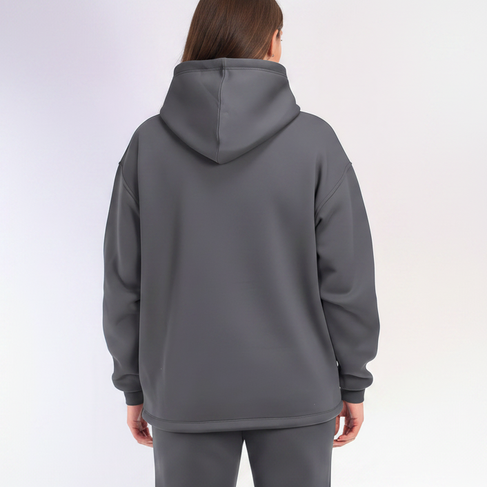 Person wearing a gray hoodie on a white background