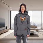 Women wearing a gray hoodie with a dog and matching pants in a minimalistic room.