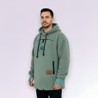 Man wearing a light green fleece hoodie with a logo on a white background