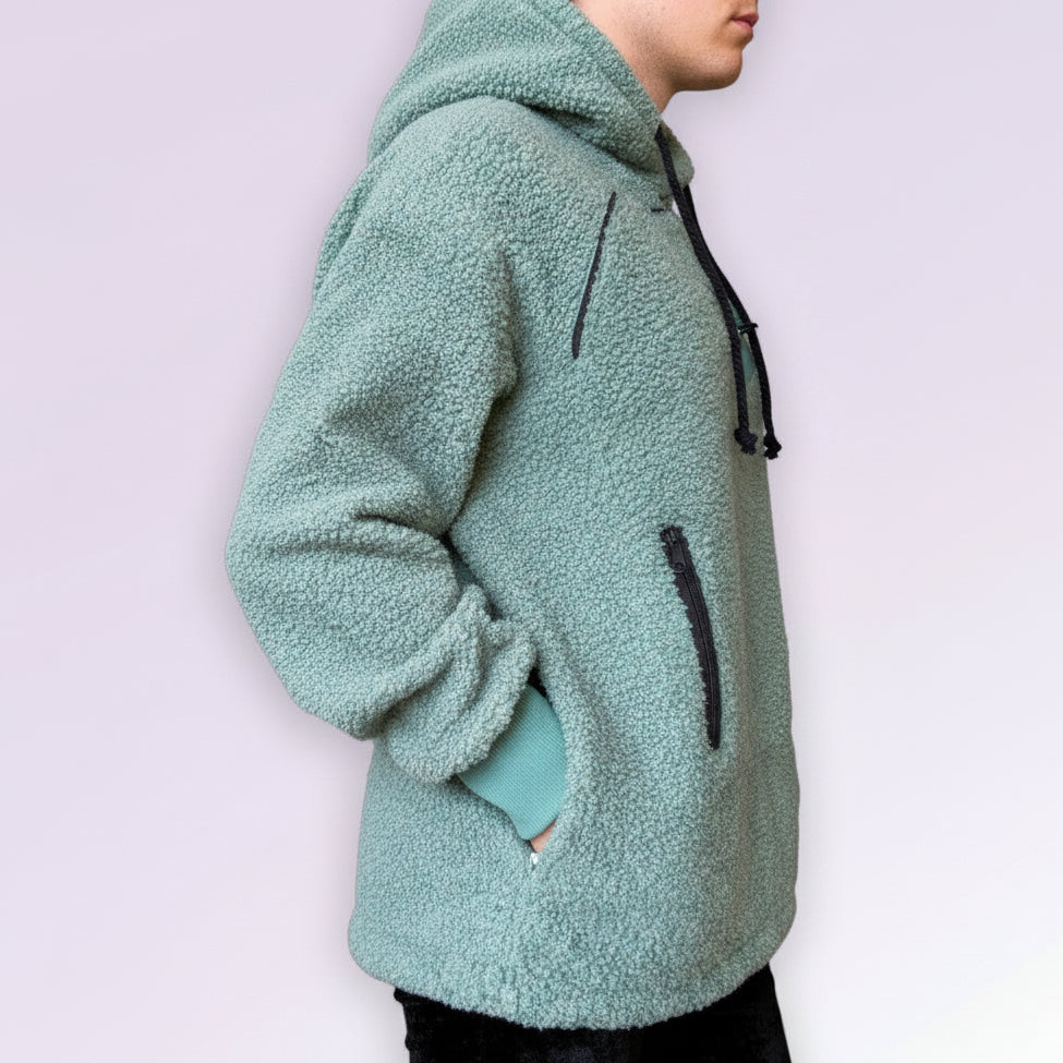Light green fleece jacket with black drawstrings on a white background