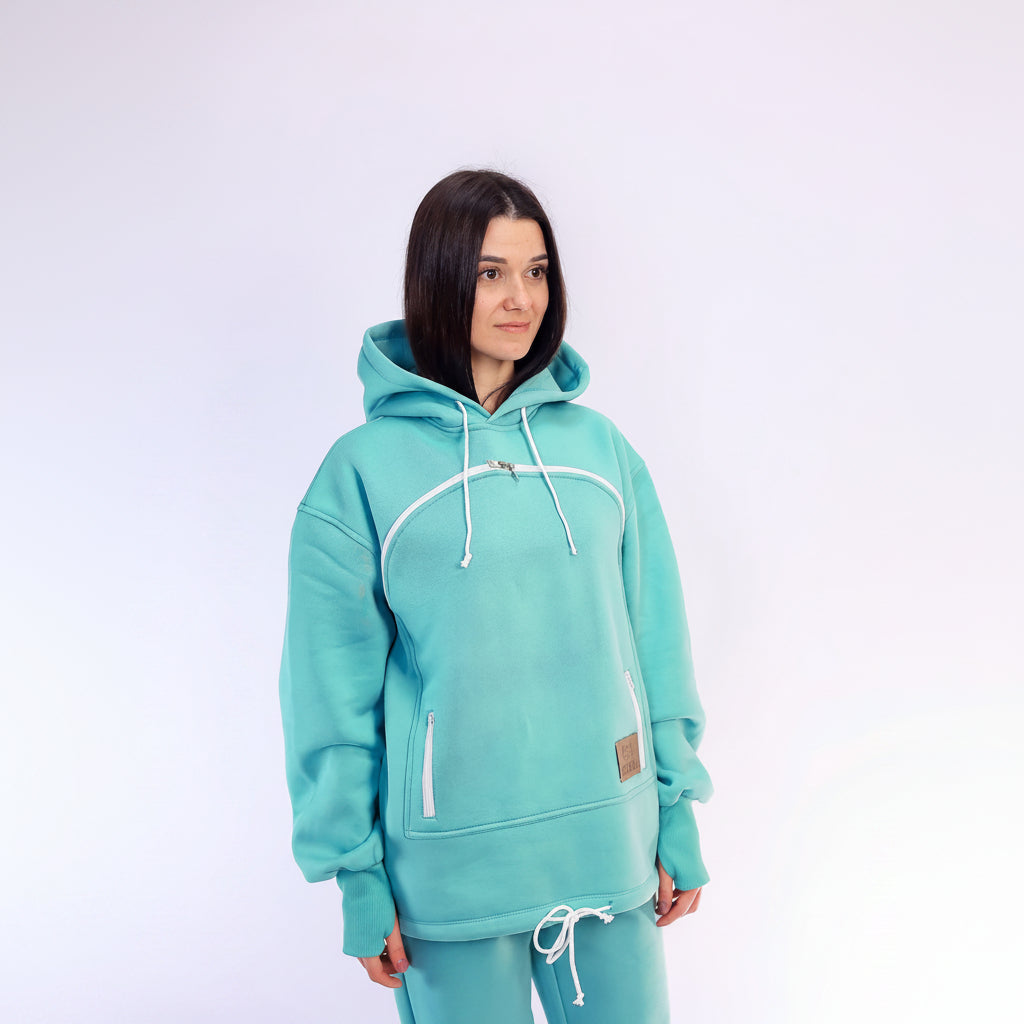 Person wearing a Mint Green hoodie and pants on a white background
