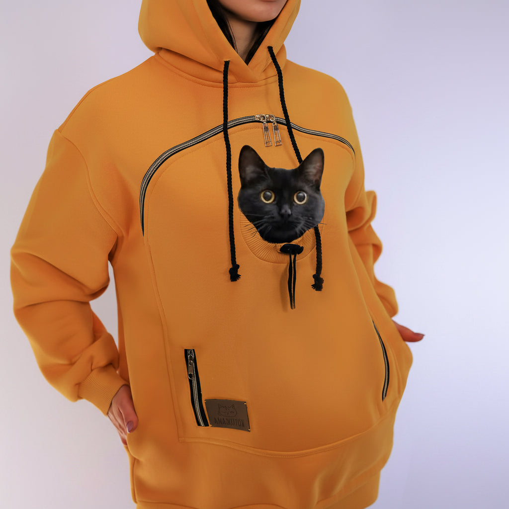 Mustard hoodie with a black cat on a white background