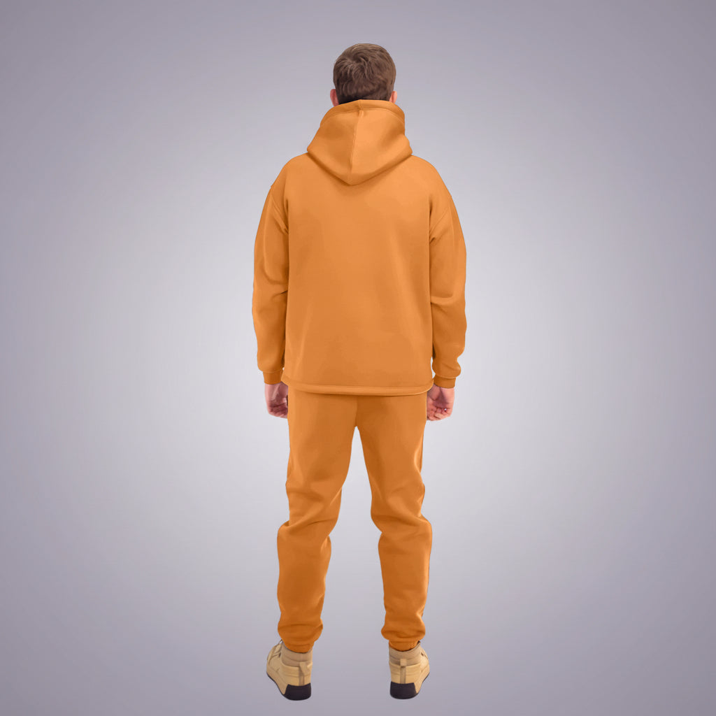 Person wearing a orange tracksuit on a white background