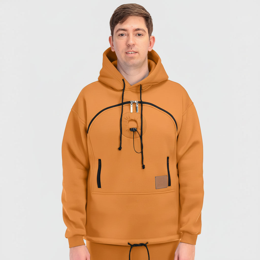 Person wearing a orange hoodie with black accents on a white background
