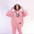 Person wearing a pink Set with a cat on a white background