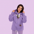 Person wearing a purple hoodie with a cat on a light purple background