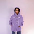 Person wearing a purple hoodie with a plain background