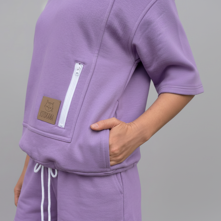 Purple hoodie and shorts set with a brown patch on a gray background