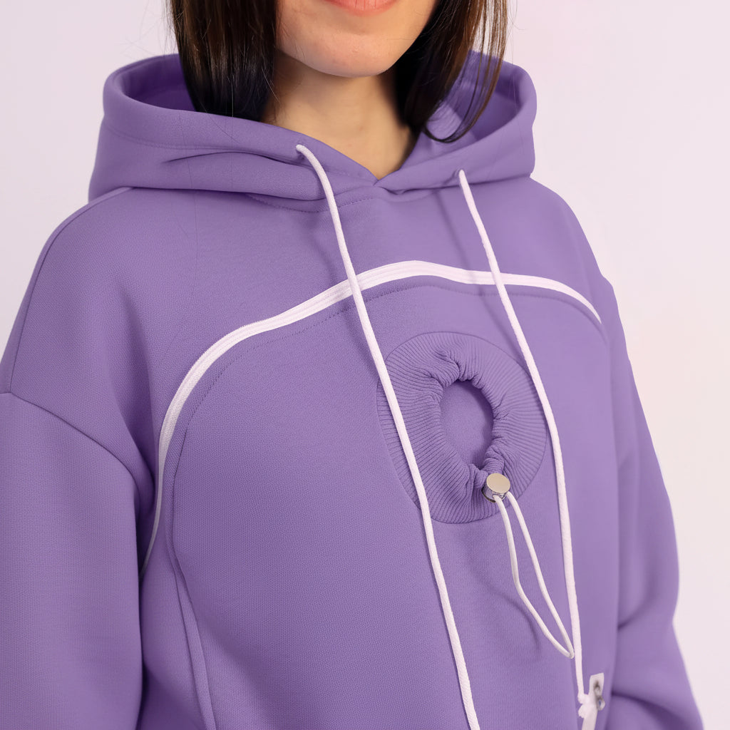 Person wearing a purple hoodie with a plain background