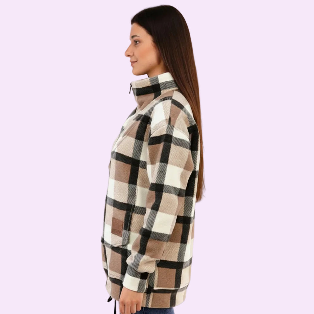 Woman wearing a plaid jacket on a white background