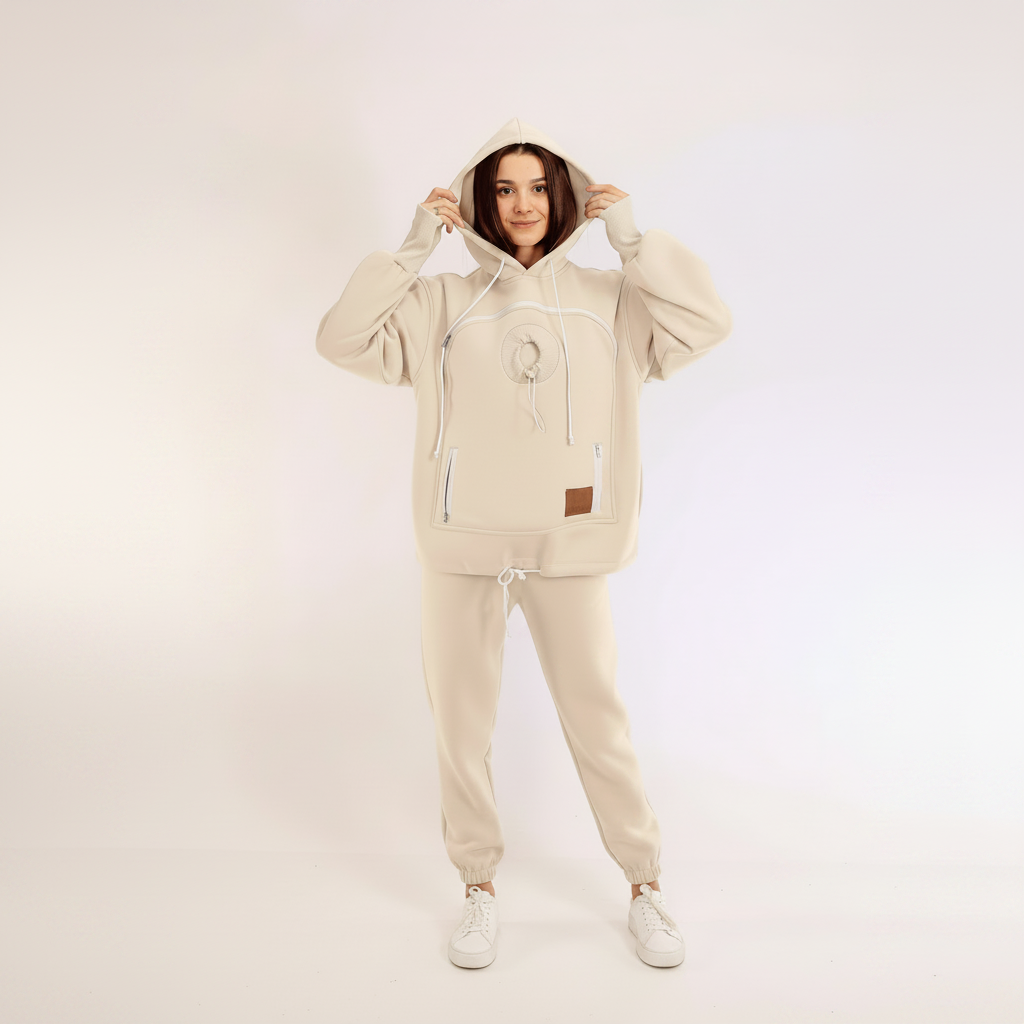 Women wearing a white tracksuit with a hood on a light background