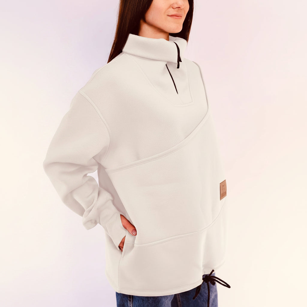 Person wearing a white sweatshirt with a white background