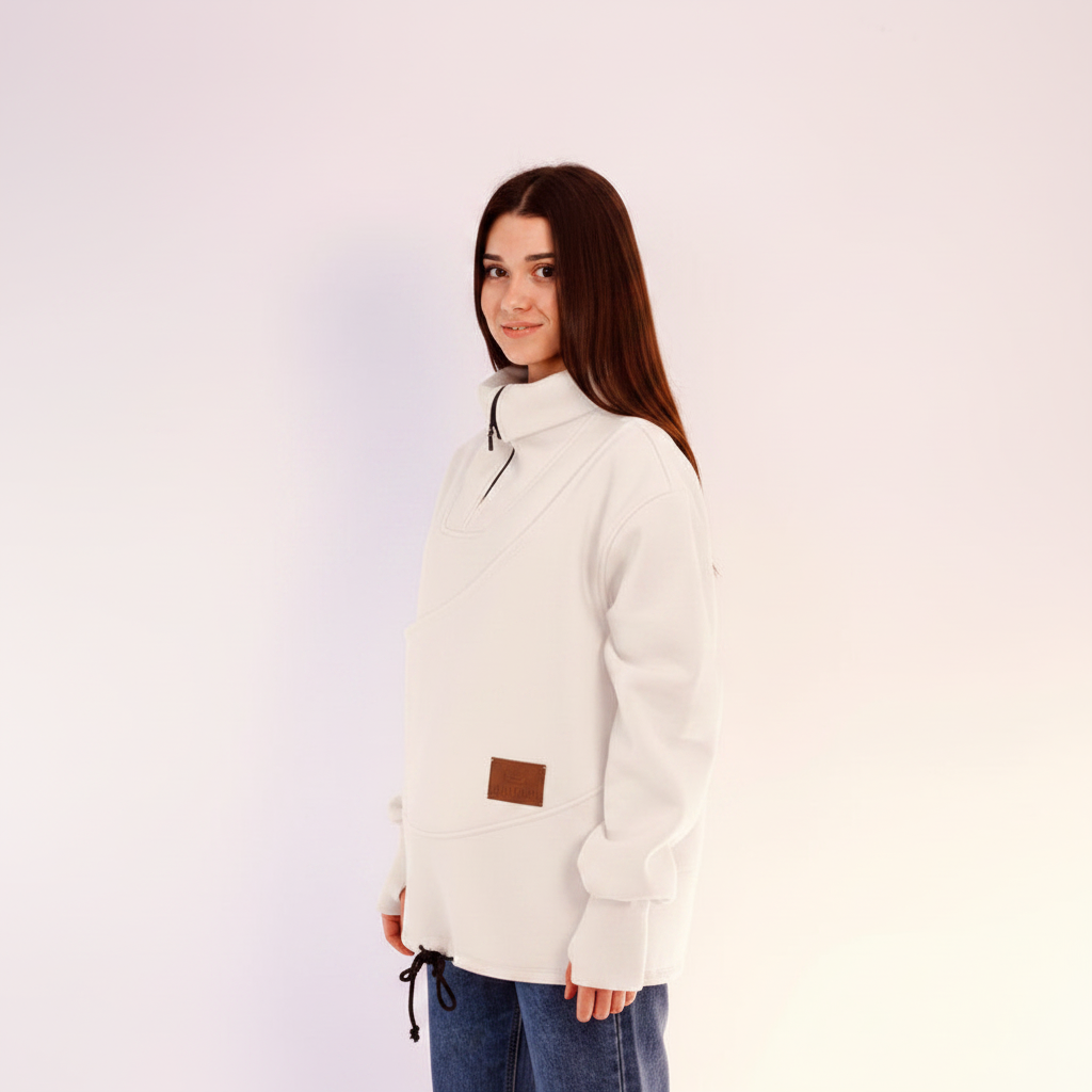women wearing a white fleece sweatshirt with a brown patch on a light pink background