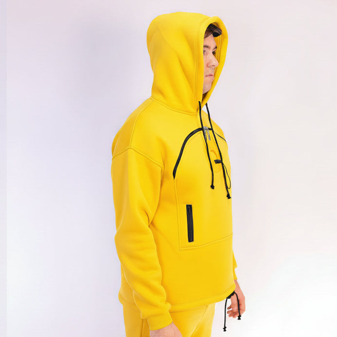 Men wearing a bright yellow hoodie and pants on a white background