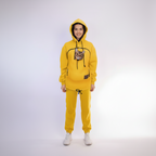 Person wearing a yellow hoodie with a cat inside on a white background