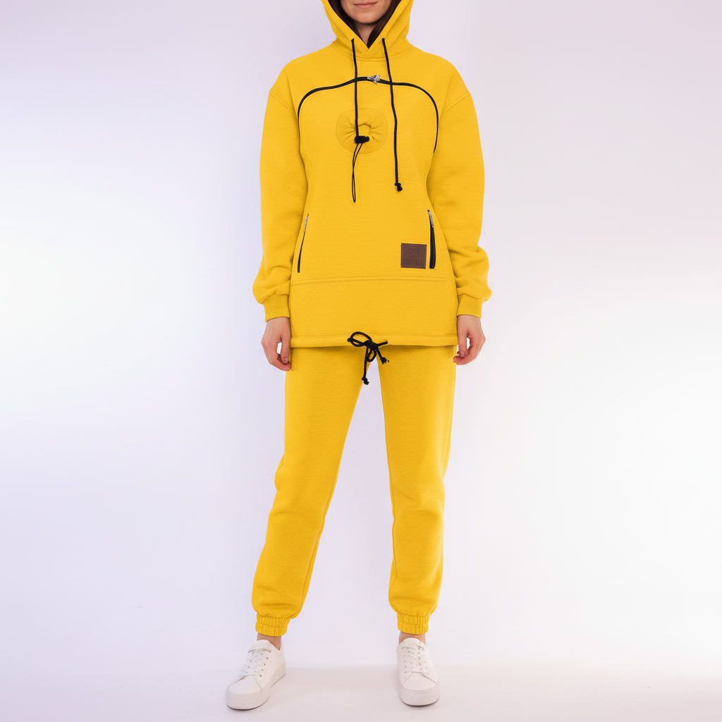 Person wearing a yellow tracksuit with a white background